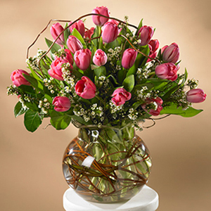 vase of pink tulips