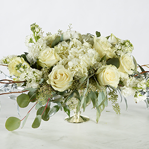 short vase of white roses and flowers